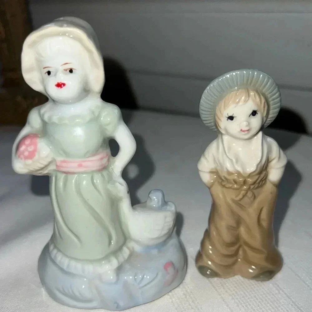 Vintage Porcelain Figurines Woman In Dress With Duck Boy Hands In Pockets